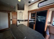 2012 Keystone Raptor RP395LEV Toy Hauler 5th wheel – 1 1/2 bathrooms!