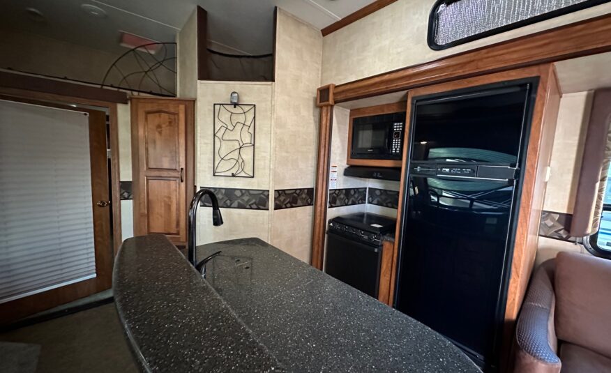 2012 Keystone Raptor RP395LEV Toy Hauler 5th wheel – 1 1/2 bathrooms!