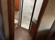 2012 Keystone Raptor RP395LEV Toy Hauler 5th wheel – 1 1/2 bathrooms!